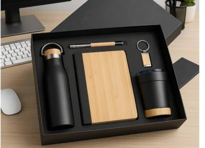 Premium black bamboo corporate gift set with bottle, notebook, pen, tumbler and keychain for employee gifting