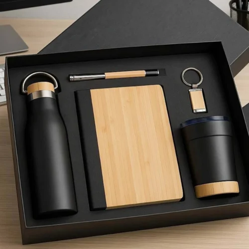 Premium black bamboo corporate gift set with bottle, notebook, pen, tumbler and keychain for employee gifting